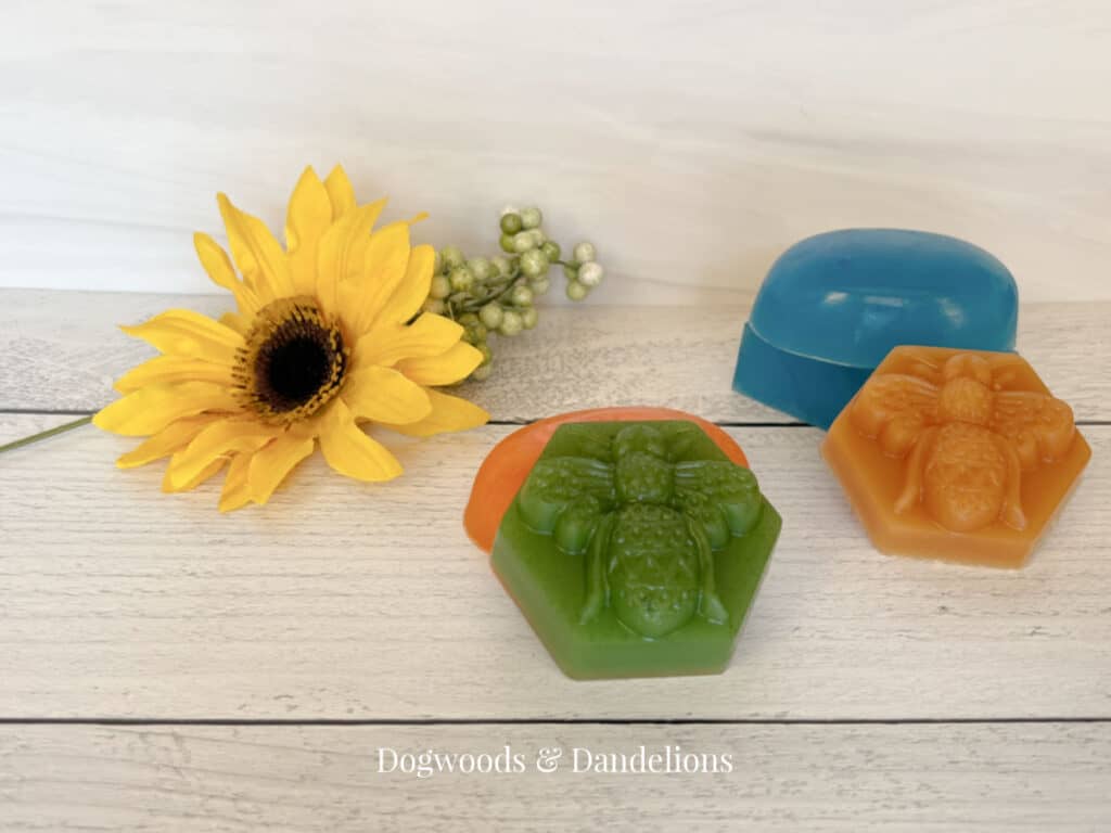 5 handmade soap gifts beside a flower