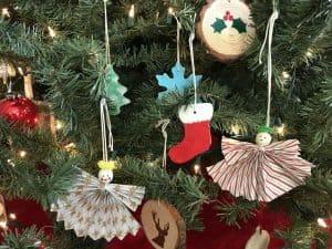 Assortment of homemade ornaments hanging on our Christmas tree