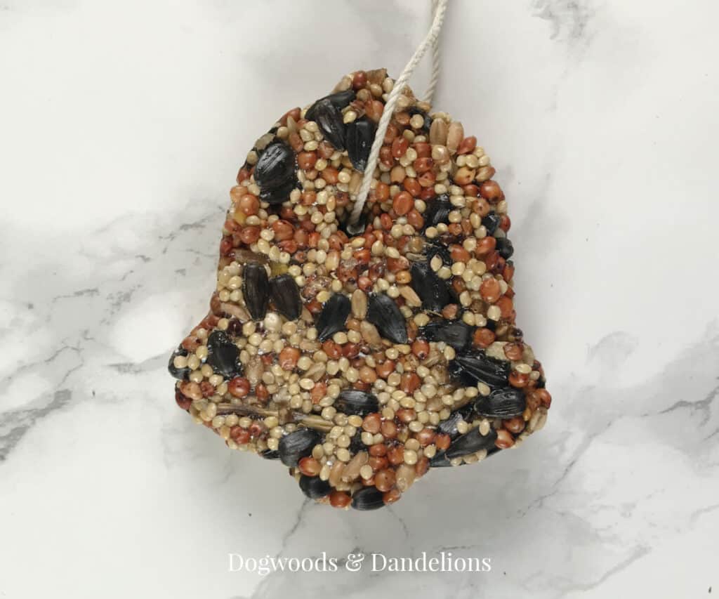 a bell shaped birdseed ornament