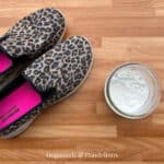 leopard print shoes beside a jar of DIY shoe powder
