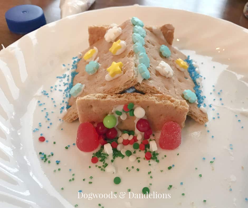 a small gingerbread house made from graham crackers