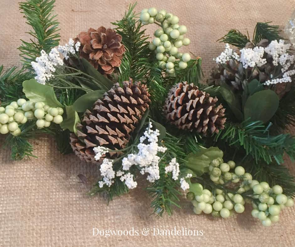 pinecones and other assorted greenery on a dining room table